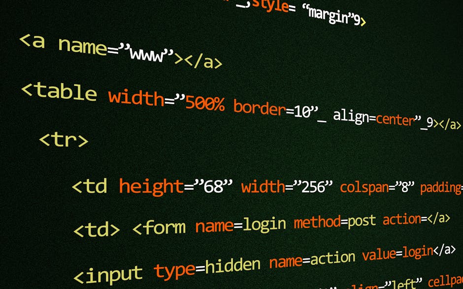 The image depicts a person seated at a desk working on a laptop that displays lines of colorful computer code on its screen. The individual, viewed from behind and dressed in a light blue shirt, is ho